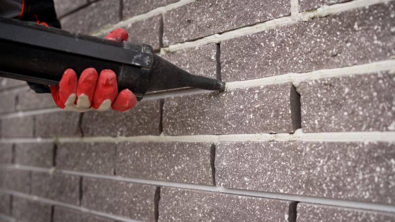 Applying mortar to brick joints